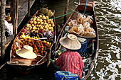 Thailand, Locals sell fruits, food and products at Damnoen Saduak floating market near Bangkok 